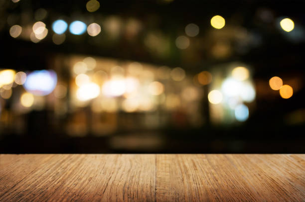 istock empty wood table in front of blurred montage night market bokeh background 1140808116