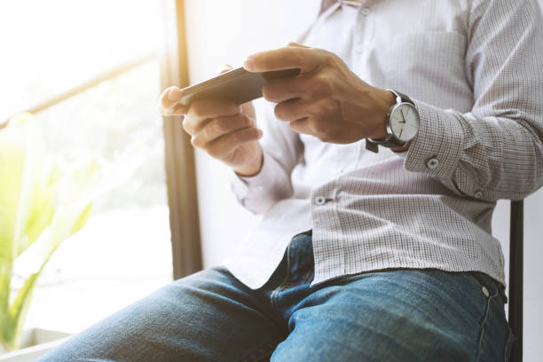 istock young asian man using  mobile device smart phone at a workplace - technology concept 1140808120