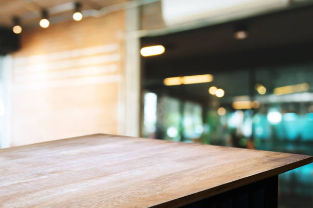 istock empty wood table desk in front of blurred coffee shop cafe background 1140808144