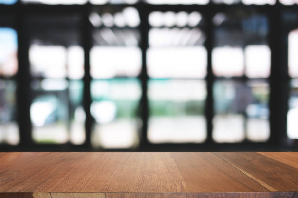 istock empty wood table desk in front of blurred coffee shop cafe background 1140808147