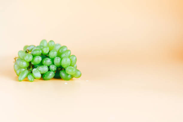 istock green grapes kish mish on orange background 1140808405