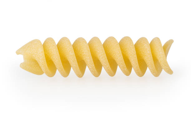 istock Uncooked fusilli pasta isolated on white background with clipping path 1140808554