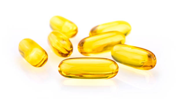 istock Fish Oil Capsules solated on white background 1140809670