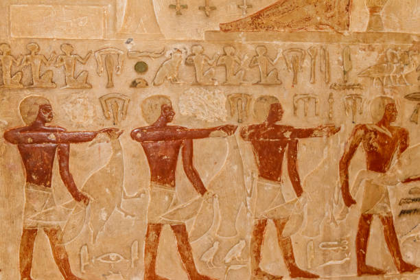istock Ancient egyptian paintings and hieroglyphs carved on the stone wall 1140811764