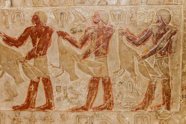 istock Ancient egyptian paintings and hieroglyphs carved on the stone wall 1140811766