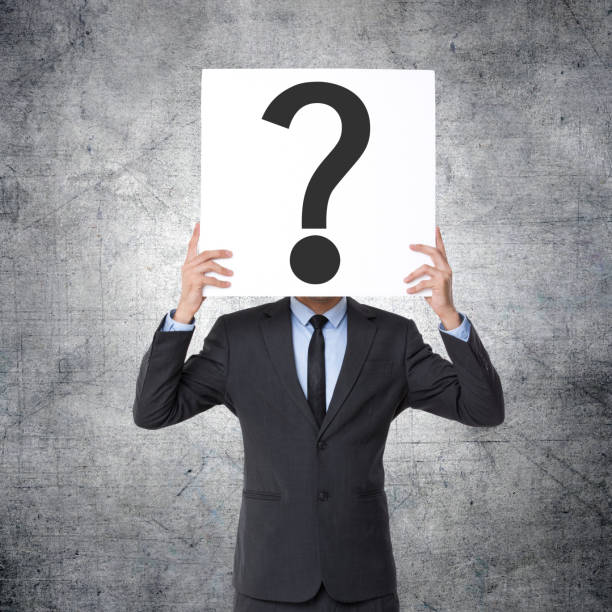 istock Businessman holding question mark sign 1140813089