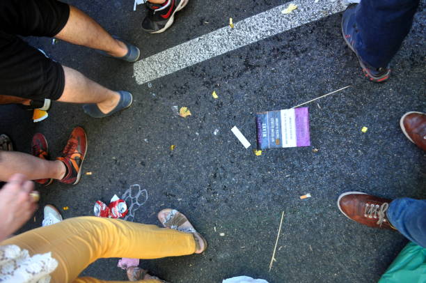 Dirt in the street during the World Pride demonstration, with a leaflet about Asexuality