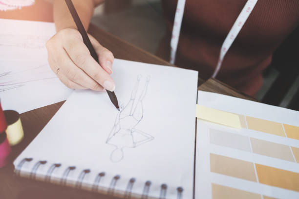istock fashion / creative designer working with sketching notebook at modern home studio, selective focus 1140815048
