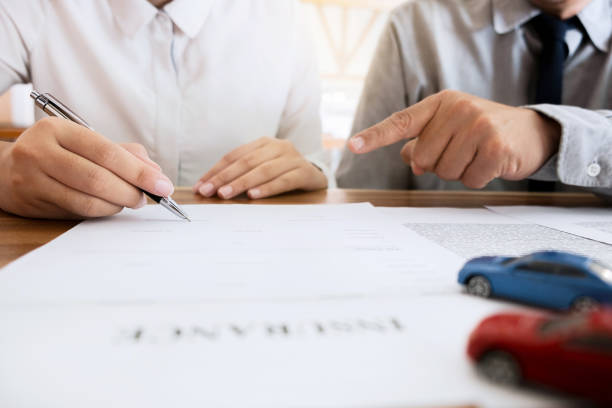 istock Insurance agent explain consulting with customer to signing the policy form. 1140815071