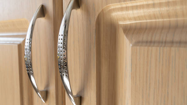 istock chrome handles for furniture doors on a light background. interior and design 1140816254