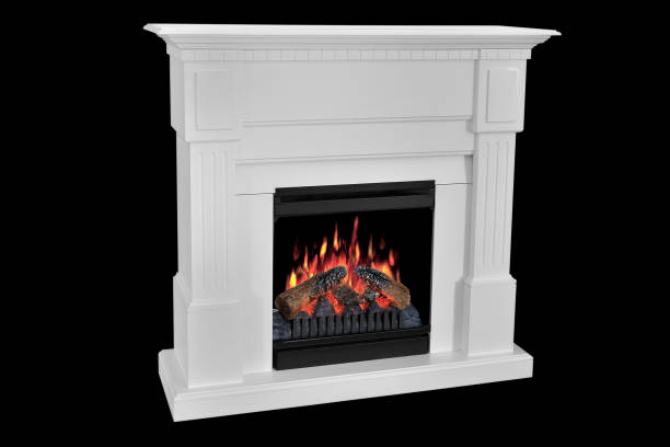 istock White wooden fireplace with roaring flames, classic elegant design. Isolated on black background, clipping path included. Fireplace as a piece of furniture 1140816428