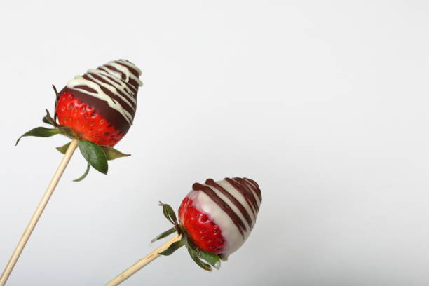 istock Strawberries glazed in black and white chocolate. On a white background. 1140817789