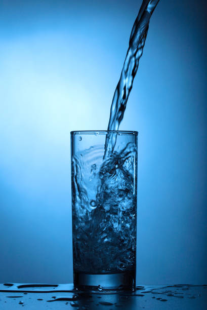 istock Water pours into the glass 1140818737