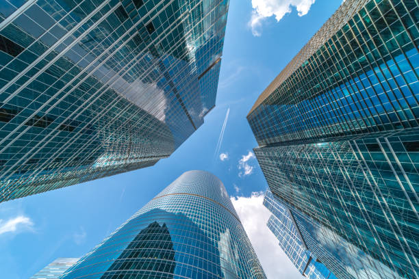 istock Modern glass city buildings during sunny day. 1140818845