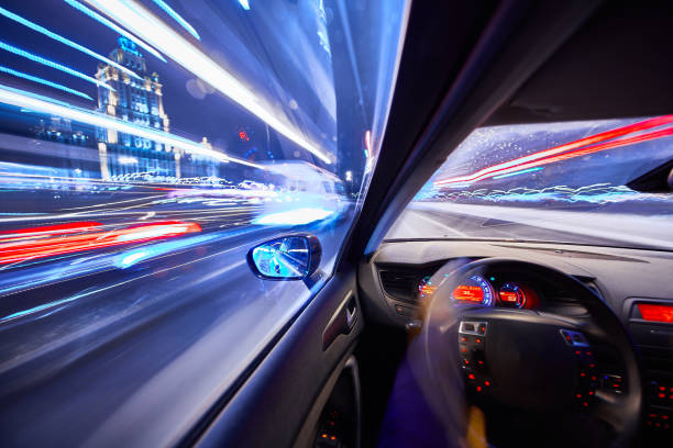 istock View from Side of Car moving in a night city 1140818977