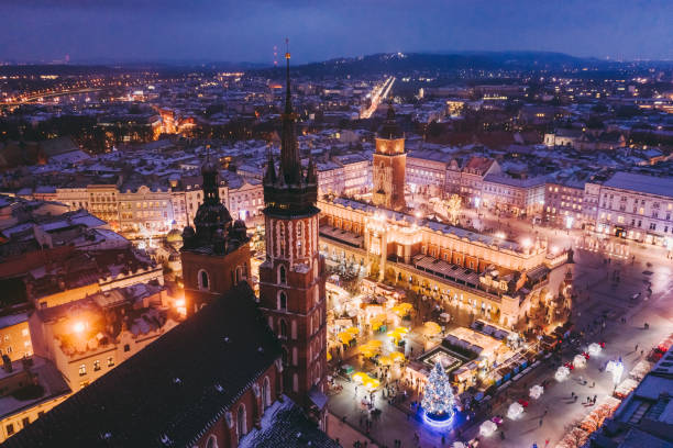 The Magic of Christmas Drone view of Krakow city at night decorated for Christmas krakow photos stock pictures, royalty-free photos & images