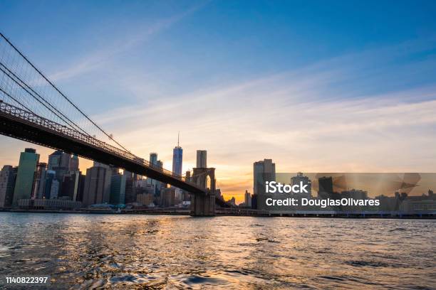 View Of The Brooklyn Bridge During A Dusk From East River New York City Stock Photo - Download Image Now