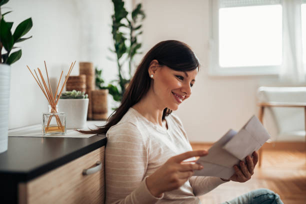 istock Charming woman receiving a letter. 1140824877