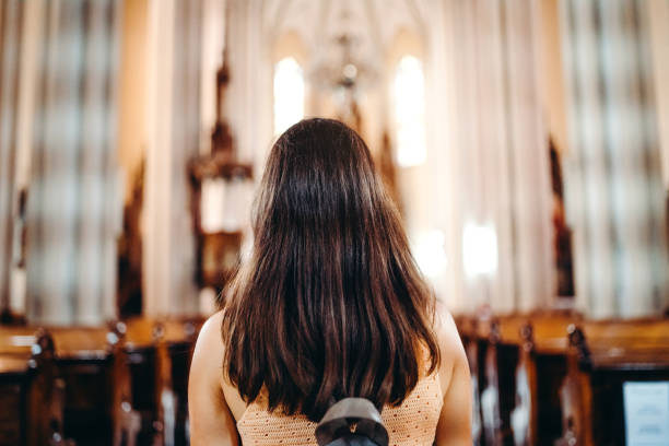 istock Young woman in the cathedral 1140825028
