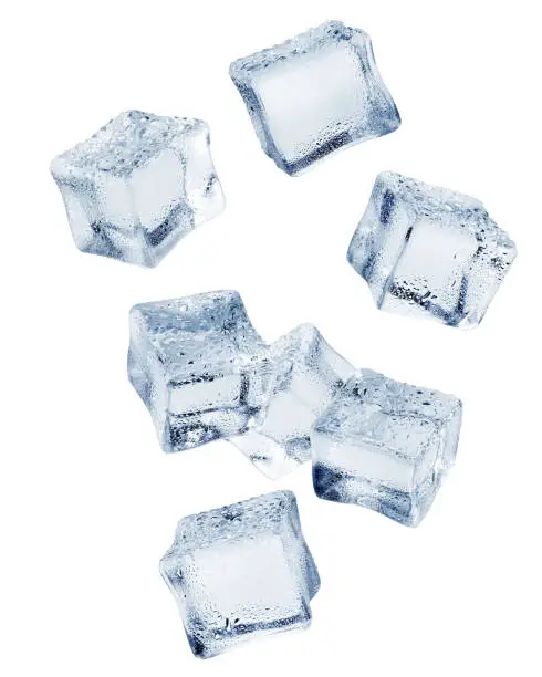Photo of Falling ice cube, isolated on white background, clipping path, full depth of field