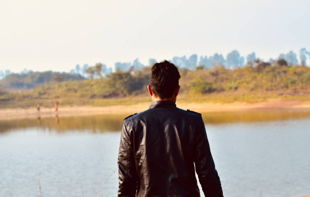 istock Man wearing black jacket standing in a place 1140825270