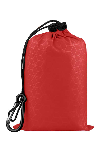 istock Very compact red nylon pocket blanket in a drawstring bag with a carabiner. Thin tarp or footprint for outdoor activities. Isolated on white background, clipping path included. 1140825454