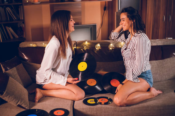 istock Two girls playing old records 1140830019