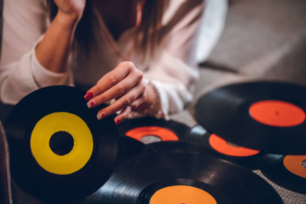 istock Young woman playing old records 1140830066