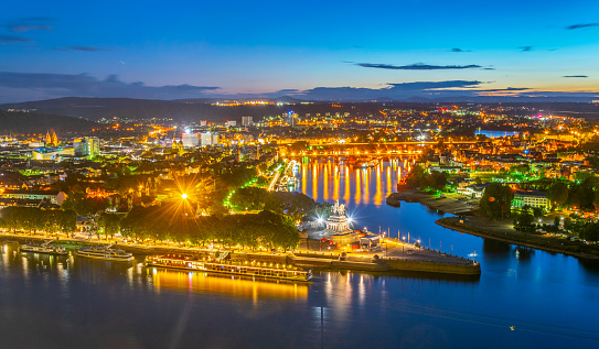 Night aerial view of confluence of Rhein and Mosel rivers in Koblenz, Germany