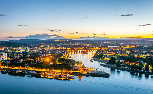 Night aerial view of confluence of Rhein and Mosel rivers in Koblenz, Germany