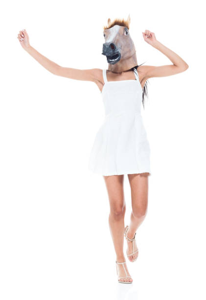 istock Cute female wearing a horse head 1140835034