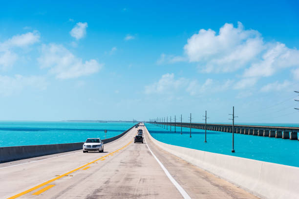 Driving on Seven Miles Bridge on a clear day Driving on Seven Miles Bridge on a clear day. Southern Florida, USA miami marathon stock pictures, royalty-free photos & images