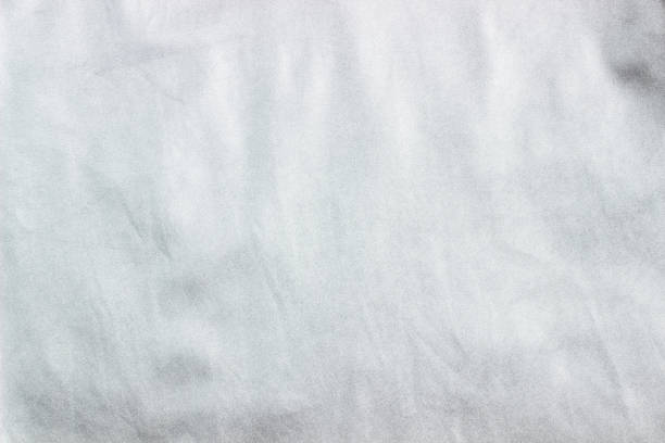 istock Concept for leather, textile and texture - closeup of crumpled gray silver metallic leather, fabric background 1140835582