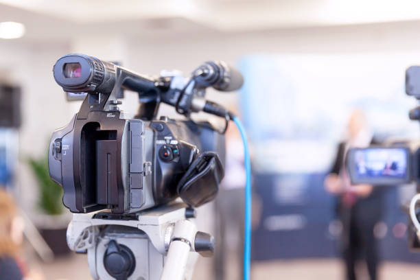 istock Filming news or press conference with a video camera 1140837018