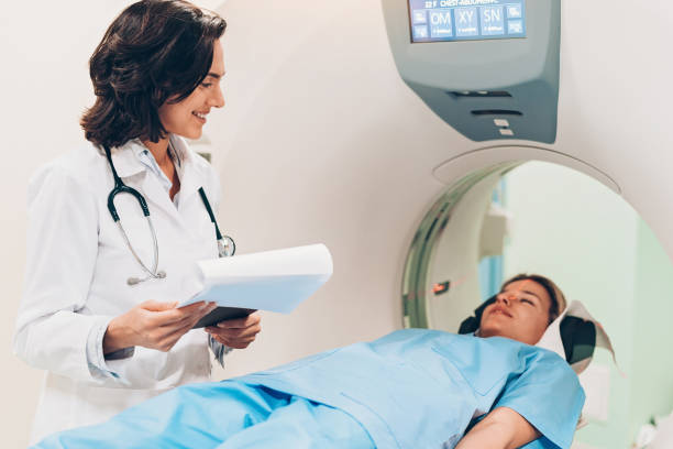istock Smiling female doctor performing a CAT scan 1140838387