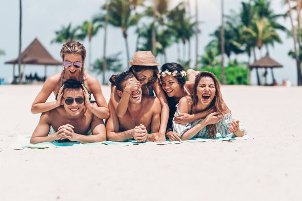 istock Carefree friends lying on the beach 1140838391