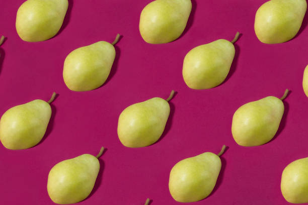 istock Half of Green Pears on Pastel Purple Background 1140838464