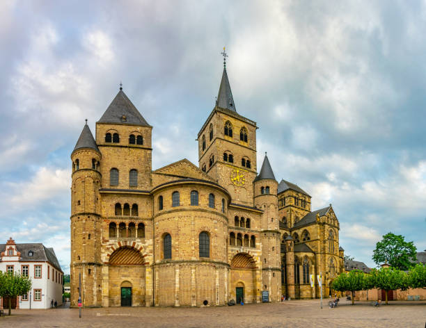 People are passing by the Cathedral in Trier, Germany