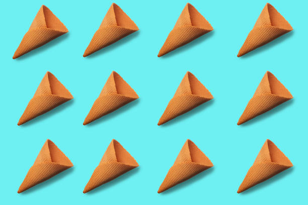 istock Ice cream cones pattern. Turquoise background. Sweet, summer and empty concept. Top view. Flat lay 1140840009