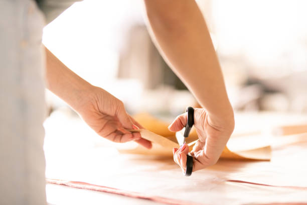 istock Hands of seamstress 1140842093