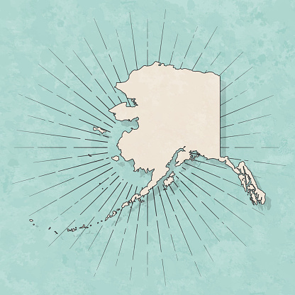 Map of Alaska in a trendy vintage style. Beautiful retro illustration with old textured paper and light rays in the background (colors used: blue, green, beige and black for the outline). Vector Illustration (EPS10, well layered and grouped). Easy to edit, manipulate, resize or colorize.