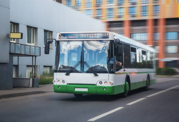 istock bus goes along street 1140842983