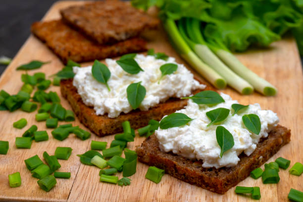 istock Whole grain bread with feta cheese and herbs. 1140848270