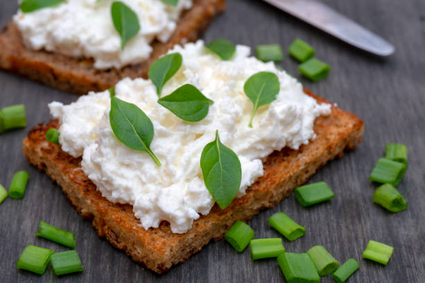 istock Whole grain bread with feta cheese and herbs. 1140848892