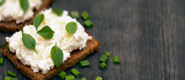 istock Whole grain bread with feta cheese and herbs. 1140848994