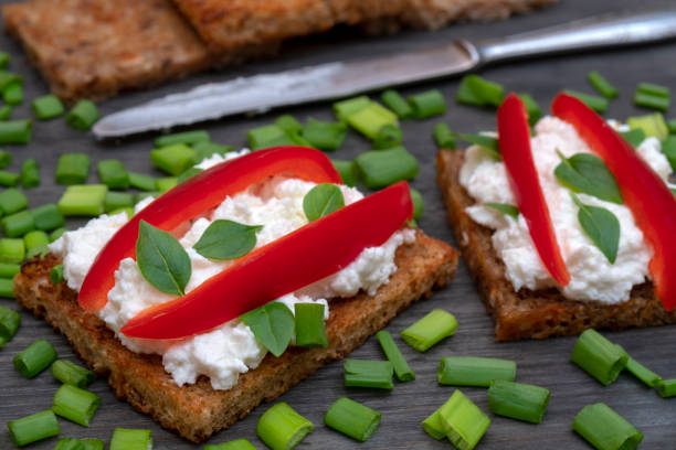 istock Whole grain bread with feta cheese and herbs. 1140849015