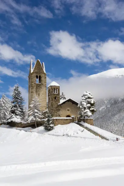 Protestant church San Gian with unrestored tower in Celerina near St. Moritz, Canton Grison, Switzerland