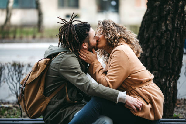 istock Kissing on park bench 1140851344