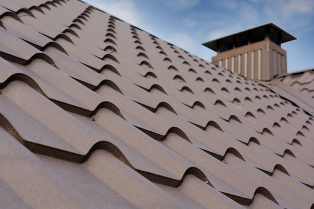 istock Metal roof construction with coaxial chimney pipe heating system against blue sky. 1140851622