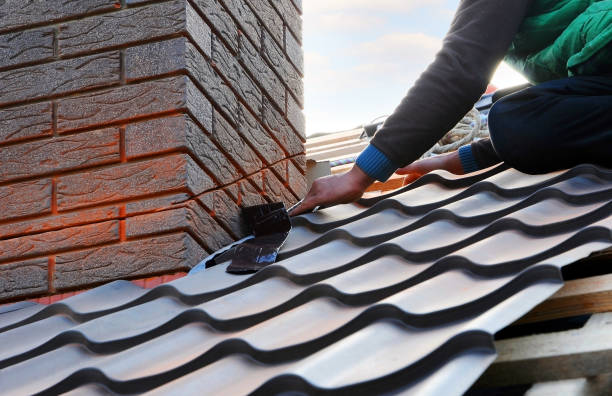 istock Roofer builder worker attach metal sheet to the chimney. Unfinished roof construction. 1140851628